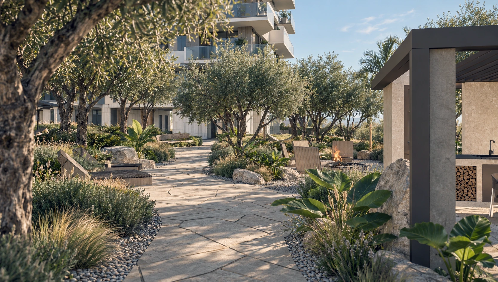 Landscaped private garden with olive trees, stone paths and outdoor seating.