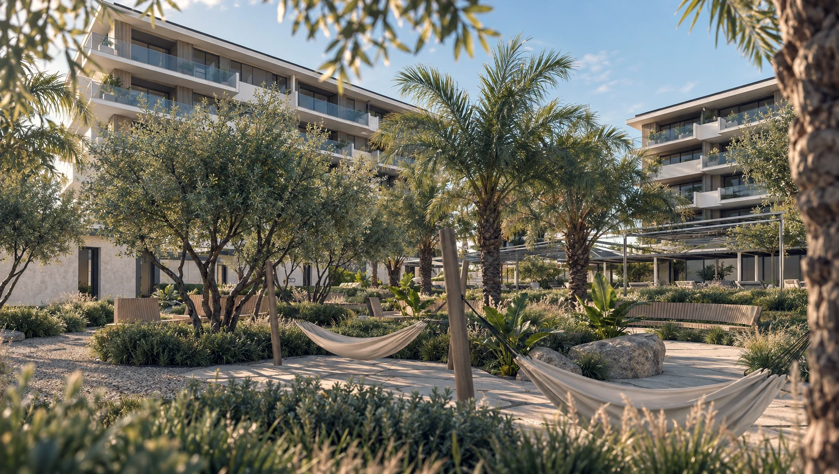 Palm trees, landscaped gardens and a hammock between the residences.
