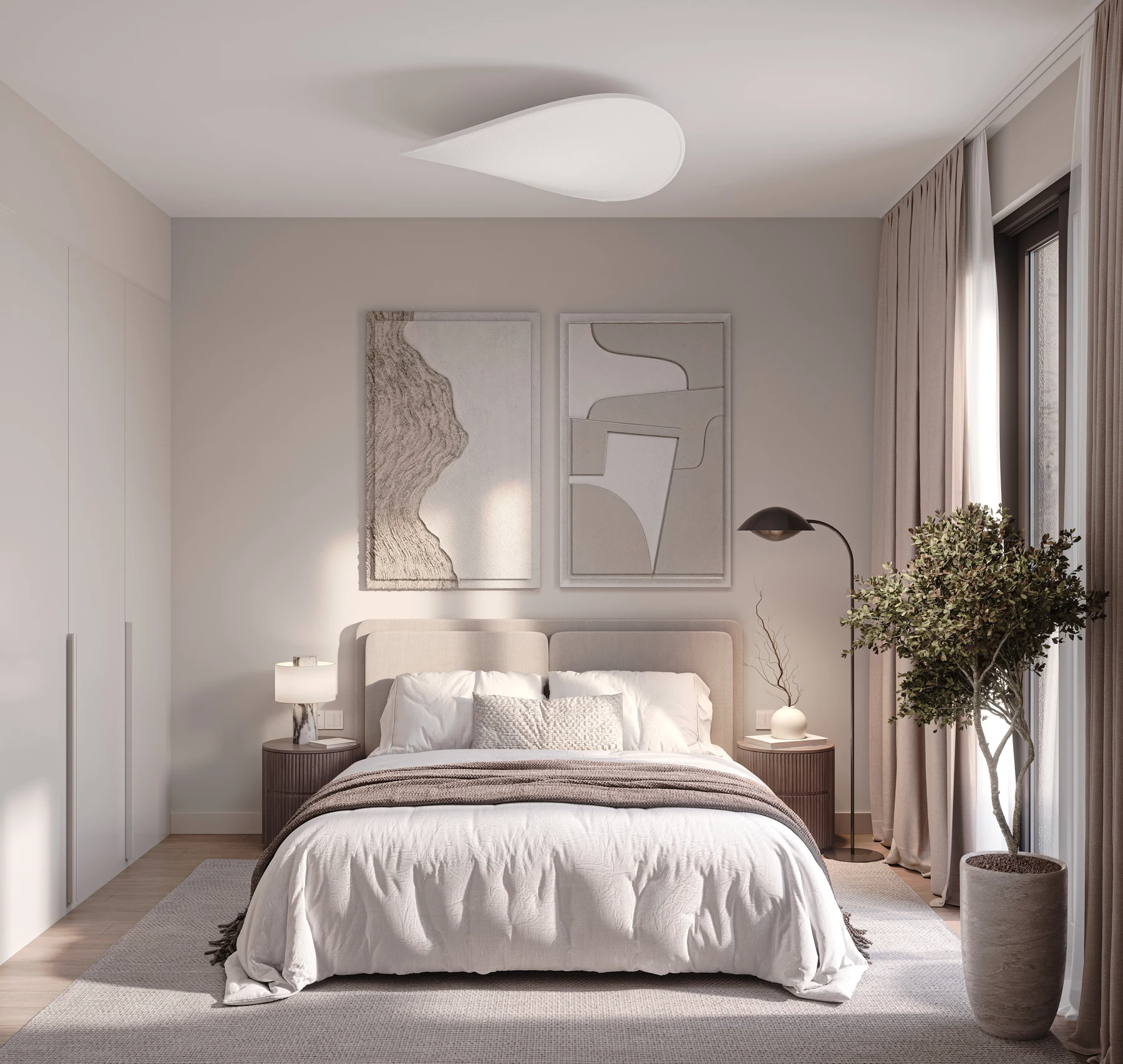 Quiet bedroom with soft textiles, a bedside lamp and an indoor tree.